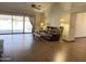 Spacious living room boasts hardwood floors and a large sliding glass door to the back patio at 1249 E Commerce Ave, Gilbert, AZ 85234