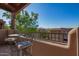 Charming balcony with metal furniture overlooking a lush green space and mountain views in the distance at 13600 N Fountain Hills Blvd # 501, Fountain Hills, AZ 85268