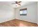 Bright bedroom with hardwood floors, ceiling fan, and a window with views at 13600 N Fountain Hills Blvd # 501, Fountain Hills, AZ 85268