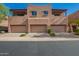 Exterior view of the townhouses featuring garages and a stylish design with balconies at 13600 N Fountain Hills Blvd # 501, Fountain Hills, AZ 85268