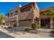 Beautiful townhouse exterior featuring garages, landscaped grounds and lovely architectural detail at 13600 N Fountain Hills Blvd # 501, Fountain Hills, AZ 85268