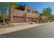 Lovely townhouse exterior featuring attached garages, nicely landscaped grounds, and balconies at 13600 N Fountain Hills Blvd # 501, Fountain Hills, AZ 85268
