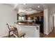 Stylish kitchen featuring granite countertops, warm wood cabinetry, and modern black appliances at 13600 N Fountain Hills Blvd # 501, Fountain Hills, AZ 85268