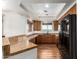 Bright kitchen features granite countertops, warm wood cabinets, and modern appliances at 13600 N Fountain Hills Blvd # 501, Fountain Hills, AZ 85268