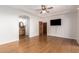 Spacious primary bedroom suite featuring a ceiling fan, access to an en-suite bathroom, and a tv at 13600 N Fountain Hills Blvd # 501, Fountain Hills, AZ 85268