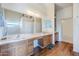 Bathroom featuring a large vanity with double sinks, great lighting, and plenty of storage at 16136 W Durango St, Goodyear, AZ 85338