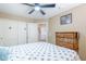 Bedroom features a fan and closet, providing storage and comfort at 16136 W Durango St, Goodyear, AZ 85338