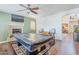 Spacious game room with a fireplace and pool table, perfect for entertaining at 16136 W Durango St, Goodyear, AZ 85338