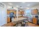 Well-lit kitchen boasts granite counters, stainless appliances, and a functional island with barstool seating at 16136 W Durango St, Goodyear, AZ 85338
