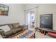Comfortable living room featuring neutral walls, carpet floors and staircase access at 16136 W Durango St, Goodyear, AZ 85338