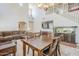 Open-concept living and dining area with staircase, high ceilings, neutral walls and flooring at 16136 W Durango St, Goodyear, AZ 85338