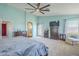 Spacious main bedroom with ample natural light, soft carpet, and backyard access at 16136 W Durango St, Goodyear, AZ 85338