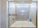 Bright bathroom shower with a glass enclosure and a bathtub for a spa-like experience at 16136 W Durango St, Goodyear, AZ 85338
