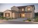 Beautiful two-story home with well-manicured landscaping and a spacious two-car garage at 16717 W Questa Dr, Surprise, AZ 85387