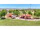 Playground with multiple structures and picnic tables at 16717 W Questa Dr, Surprise, AZ 85387