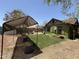 Charming backyard with a garden bed cover and grassy area at 1813 E Willetta St, Phoenix, AZ 85006