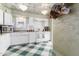 Charming kitchen boasts a decorative ceiling, ample cabinetry, and hanging copper cookware at 1813 E Willetta St, Phoenix, AZ 85006