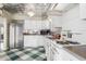 This kitchen features ample counter space, a stainless steel refrigerator, and a unique decorative ceiling at 1813 E Willetta St, Phoenix, AZ 85006