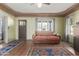 Inviting living room with hardwood floors, a comfortable sofa, and ample natural light at 1813 E Willetta St, Phoenix, AZ 85006