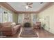 Cozy living room with a decorative fireplace, hardwood floors, and unique vintage touches at 1813 E Willetta St, Phoenix, AZ 85006
