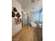 Modern bathroom with a freestanding tub, glass-enclosed shower, dual vanities, and elegant tile accents at 18747 W Monterosa St, Litchfield Park, AZ 85340
