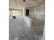 Unfinished room shows large sliding glass doors and an open-concept floor plan at 18747 W Monterosa St, Litchfield Park, AZ 85340