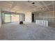 Unfinished open-concept living area with large windows and sliding glass doors, ready to be transformed at 18747 W Monterosa St, Litchfield Park, AZ 85340