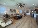 Inviting living room with cozy seating, stylish decor, natural light, and open access to the dining area at 18747 W Monterosa St, Litchfield Park, AZ 85340