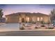 Inviting single-story home featuring a neutral color palette, tile roof and low maintenance desert landscaping at 18858 N 269Th Ln, Buckeye, AZ 85396