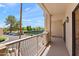 Spacious balcony offers shaded views of the parking area and community tennis courts at 19400 N Westbrook Pkwy # 220, Peoria, AZ 85382