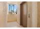 Elevator in the building near the outdoor window view with palm trees at 19400 N Westbrook Pkwy # 220, Peoria, AZ 85382