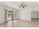 A bright, open living room space with balcony access and neutral colors at 19400 N Westbrook Pkwy # 220, Peoria, AZ 85382