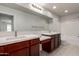 Primary bathroom with double sinks, a vanity area, and a shower-tub combo at 2000 N 36Th St # 10, Phoenix, AZ 85008