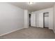 Bedroom with neutral walls, carpet flooring, and two closets, offering ample storage space at 2000 N 36Th St # 10, Phoenix, AZ 85008