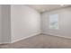 Neutral bedroom with plush carpet, a window with blinds, and light-colored walls at 2000 N 36Th St # 10, Phoenix, AZ 85008