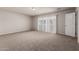 Spacious bedroom with carpet, neutral walls, a sliding door, and closet at 2000 N 36Th St # 10, Phoenix, AZ 85008