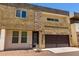 Modern two-story home featuring mixed stone and stucco facade and a large two-car garage at 2000 N 36Th St # 10, Phoenix, AZ 85008