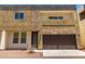 Modern two-story home featuring mixed stone and stucco facade and a large two-car garage at 2000 N 36Th St # 10, Phoenix, AZ 85008