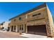 Modern two-story home featuring mixed stone and stucco facade and a large two-car garage at 2000 N 36Th St # 10, Phoenix, AZ 85008