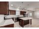 Modern kitchen with stainless appliances, dark wood cabinets, island and tile flooring at 2000 N 36Th St # 10, Phoenix, AZ 85008