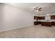 Open-concept living room and kitchen with tile floors, stainless appliances, and brown cabinets at 2000 N 36Th St # 10, Phoenix, AZ 85008