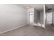 Loft with neutral walls and carpet, with a view of a staircase and bedroom doors at 2000 N 36Th St # 10, Phoenix, AZ 85008