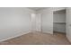 This cozy bedroom has neutral carpet flooring, with a view of the walk-in closet at 2000 N 36Th St # 41, Phoenix, AZ 85008