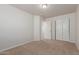 Bedroom featuring neutral walls, carpet, and a double-door closet at 2000 N 36Th St # 41, Phoenix, AZ 85008