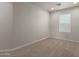 This bedroom features neutral paint, carpet, and a window with blinds at 2000 N 36Th St # 41, Phoenix, AZ 85008