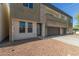Exterior of a modern style townhome with stone accents, a private garage, and low maintenance landscaping at 2000 N 36Th St # 41, Phoenix, AZ 85008