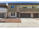 Modern two-story townhome featuring a private garage, stone accents, and neutral color palette at 2000 N 36Th St # 41, Phoenix, AZ 85008