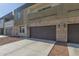 Modern two-story townhome with private garage, stone accents, and clean architectural lines at 2000 N 36Th St # 41, Phoenix, AZ 85008