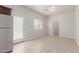Bright and airy kitchen area with stainless steel refrigerator and access to the back yard at 2000 N 36Th St # 41, Phoenix, AZ 85008