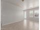 Bright living room with tile flooring, neutral walls, and natural light from windows and a glass door at 2000 N 36Th St # 41, Phoenix, AZ 85008
